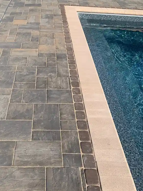 Paver coping set against a liner, shot upright